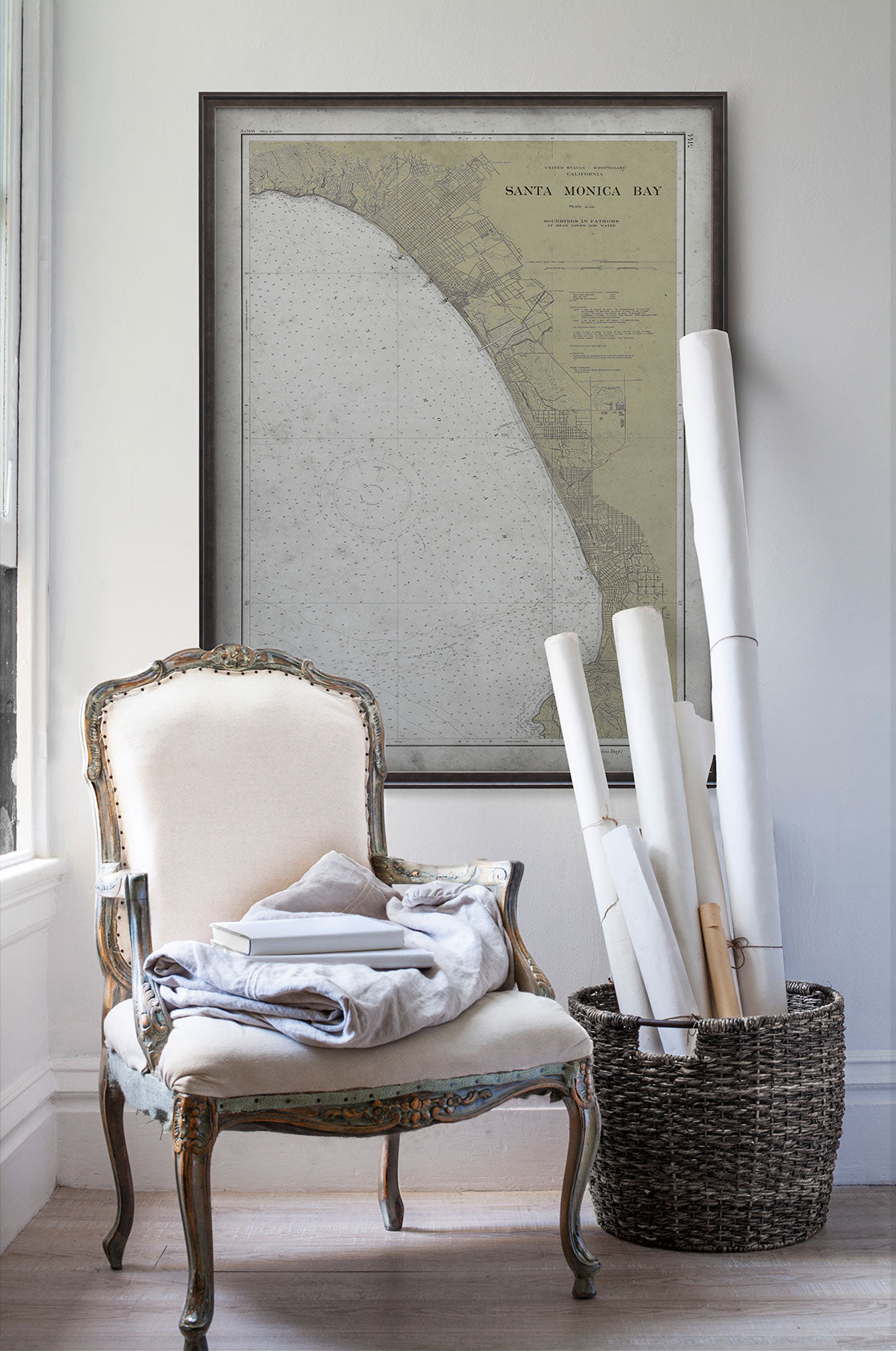 Vintage historic nautical chart of Santa Monica in room with white walls with vintage furniture and vintage decor.